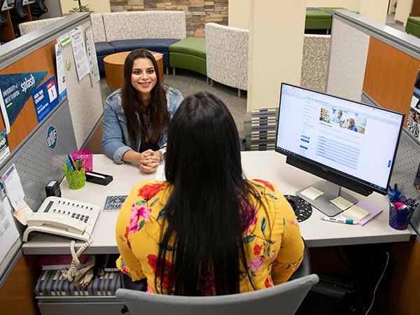 student working with a financial aid counselor in argo central