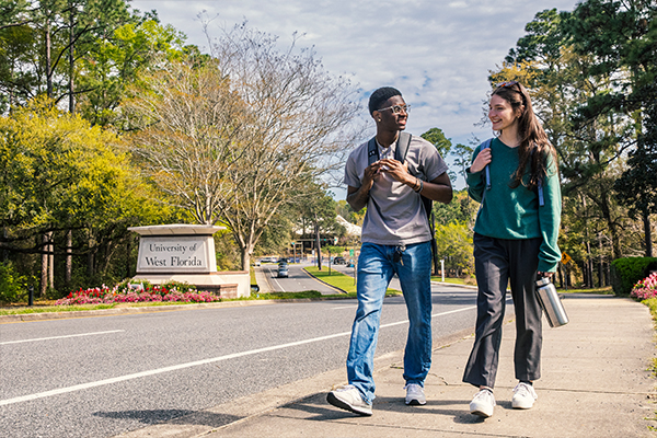 students walking in front of UWF