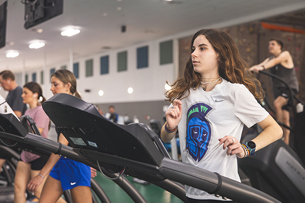 Student running on a treadmill.