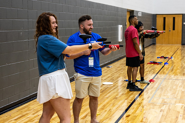 Students playing Indoor Paintball.