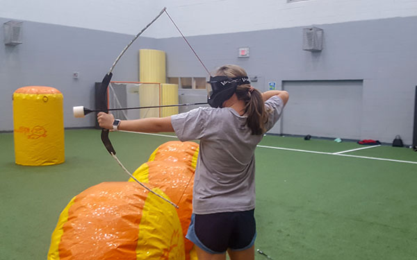 Student playing archery tag