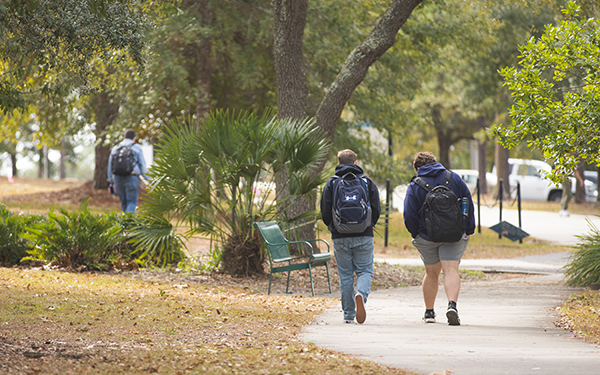 Two students walking on campus