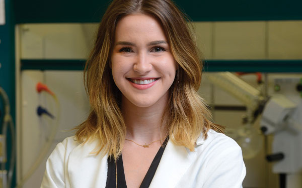 Nurse standing in front of equipment