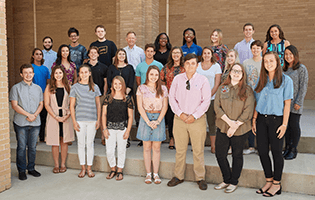 Pensacola Pledge Scholarship recipients pose for a group photo with Quint Studer.