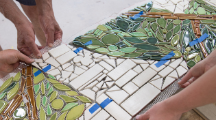 Tiles are placed on the cement bench at the University of West Florida in Pensacola, Florida