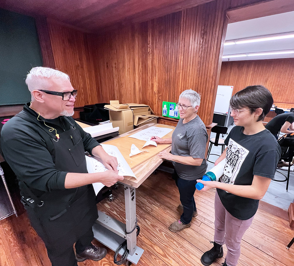 People gathered talking about projects