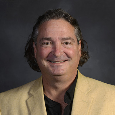 Gregory Cook indoor headshot.