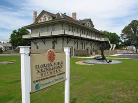 Exterior of a two story former train station that now serves as the FPAN coordinating center. Building is light tan in color