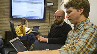 Professor and student collaborate