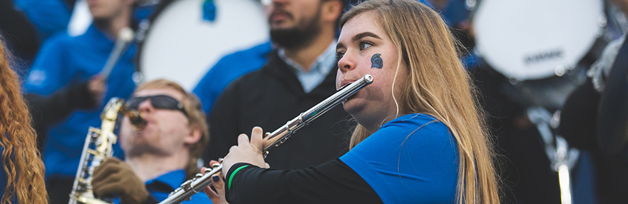 A student playing a flute