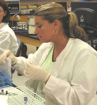 Student in the lab performing a transfusion