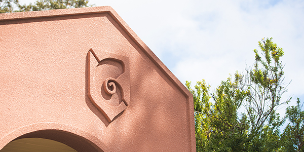 UWF-shaped bushes at campus main entrance
