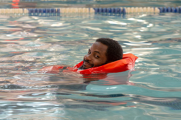 Community member swimming in the Aquatic Center pool.