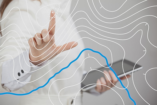 hand using a touchscreen map interface